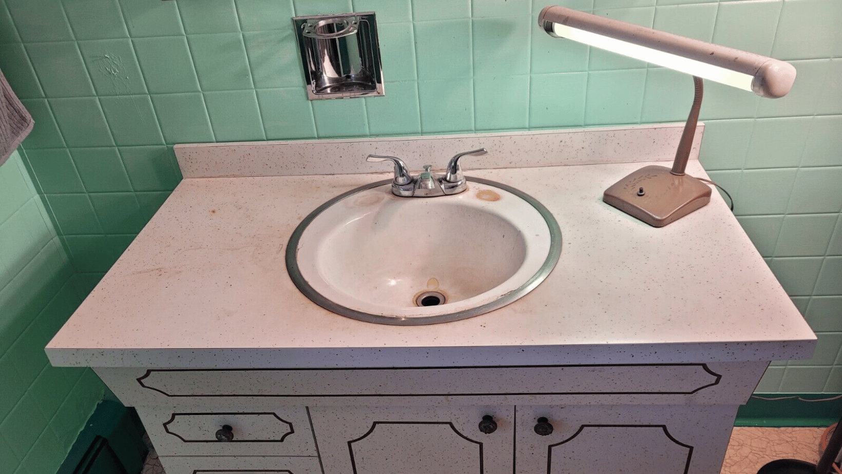 Used bathroom vanity with some glaring hygiene concerns.